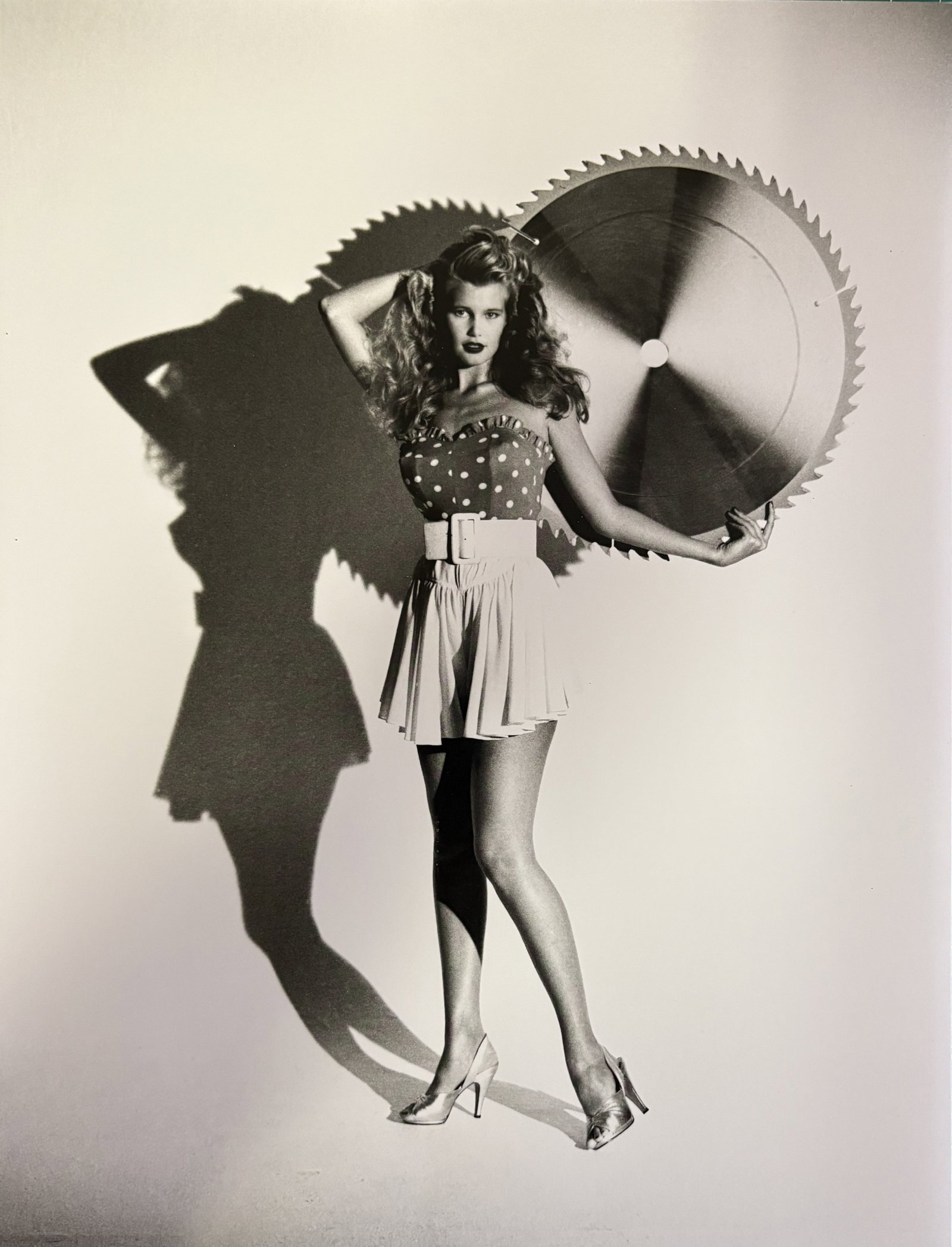 HELMUT NEWTON RITA HAYWORTH DUOTONE PRINT: Helmut Newton Rita Hayworth Duotone Print mounted to board measuring at 9.5x12.5 inches