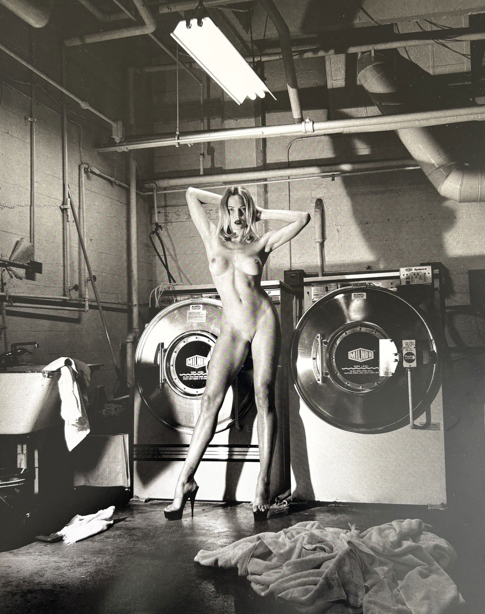 HELMUT NEWTON DOMESTIC NUDE III PHOTO LITHO: Helmut Newton Domestic Nude III Photo Litho mounted to board measuring at 9.5x12 inches.