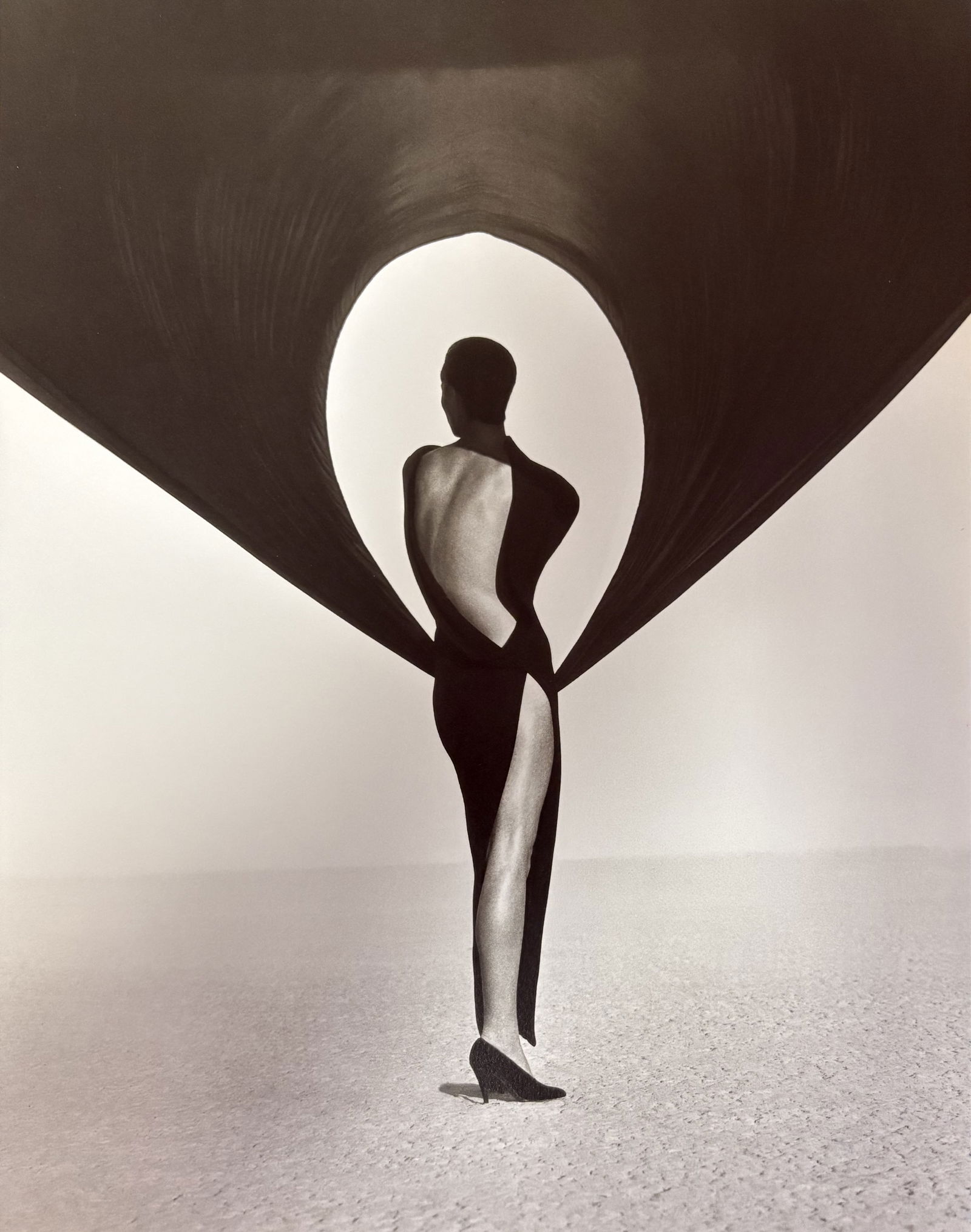 HERB RITTS VERSACE BLACK DRESS PHOTO LITHO: Herb Ritts Versace Black Dress Photo Litho mounted to board measuring at 8.75x11 inches.