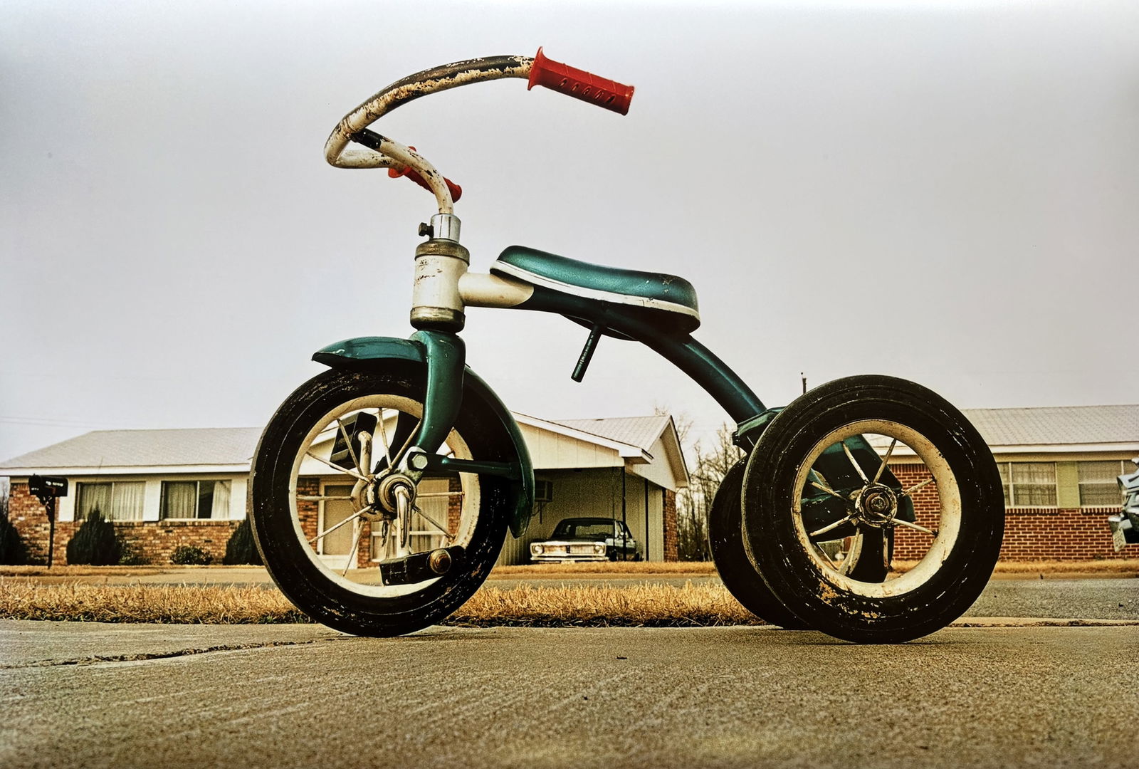 WILLIAM EGGLESTON TRICYCLE PRINT: William Eggleston Tricycle Print measuring at 20.5x30 inches.