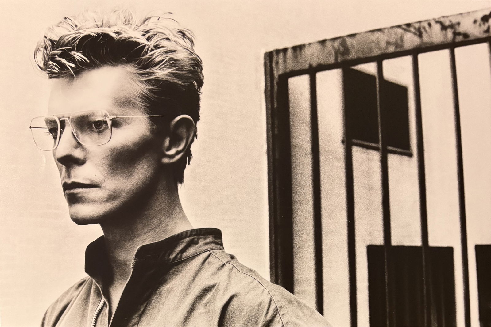 HELMUT NEWTON DAVID BOWIE PRINT: Helmut Newton David Bowie Print mounted to board measuring at 9.5x14.25 inches.