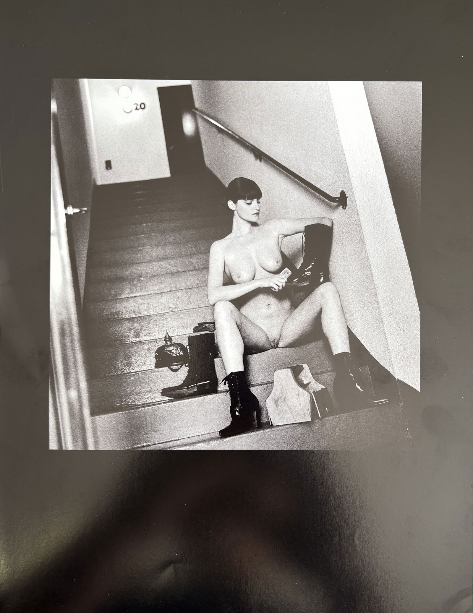 HELMUT NEWTON EVA MILITARY LITHO: Helmut Newton Eva Military Litho mounted to same size board measuring at 8.75x11.5 inches