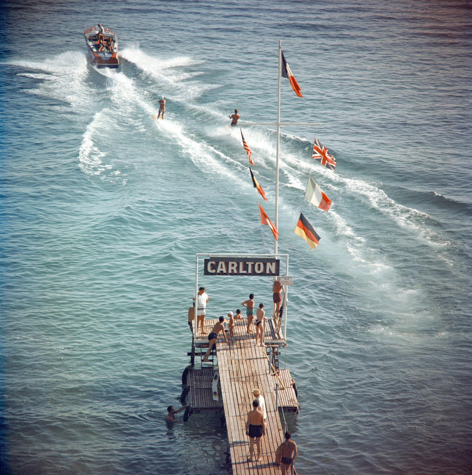 SLIM AARONS CANNES WATERSPORTS PRINT: Slim Aarons Cannes Watersports Print measuring at 30x30 inches