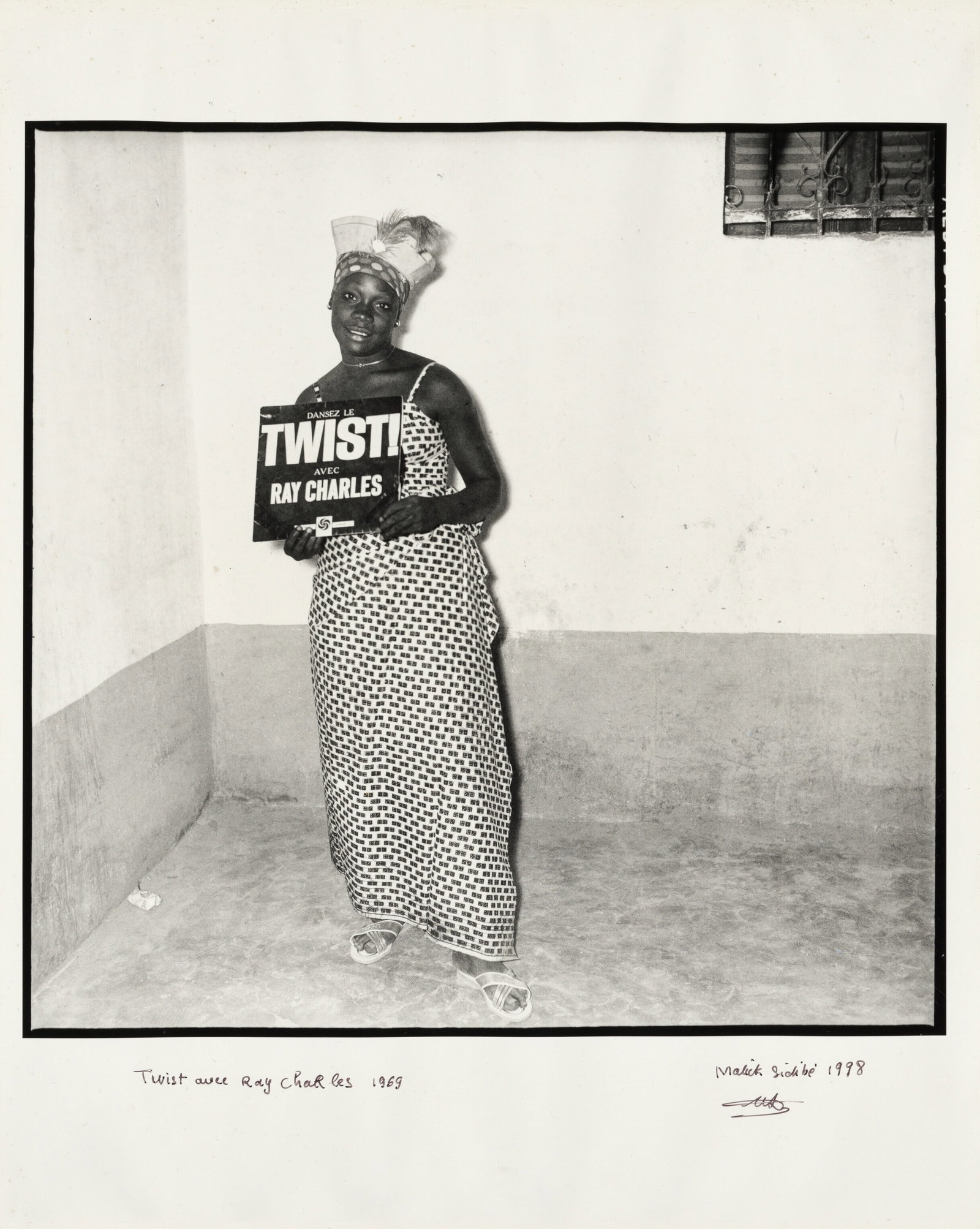 MALICK SIDIBE TWIST AVEC RAY CHARLES PRINT: Malick Sidibe Twist Avec Ray Charles Print mounted to board measuring at 16x20 inches. Signed in the plate.