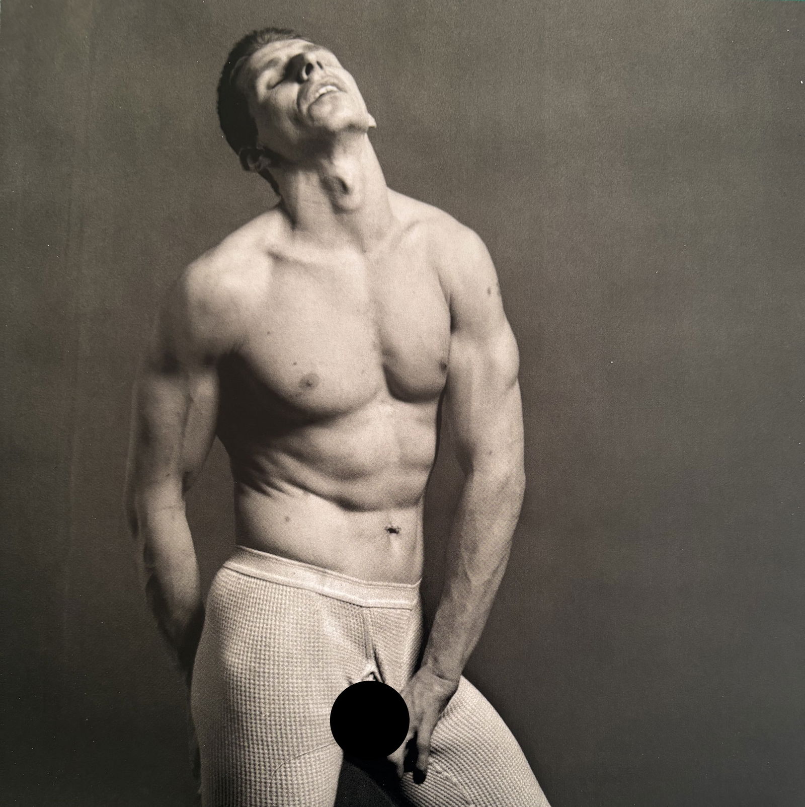 ROBERT MAPPLETHORPE LARRY NUDE PHOTO LITHO: Robert Mapplethorpe Larry Nude photo lithograph mounted to same size board measuring at 8.5x8.5 inches