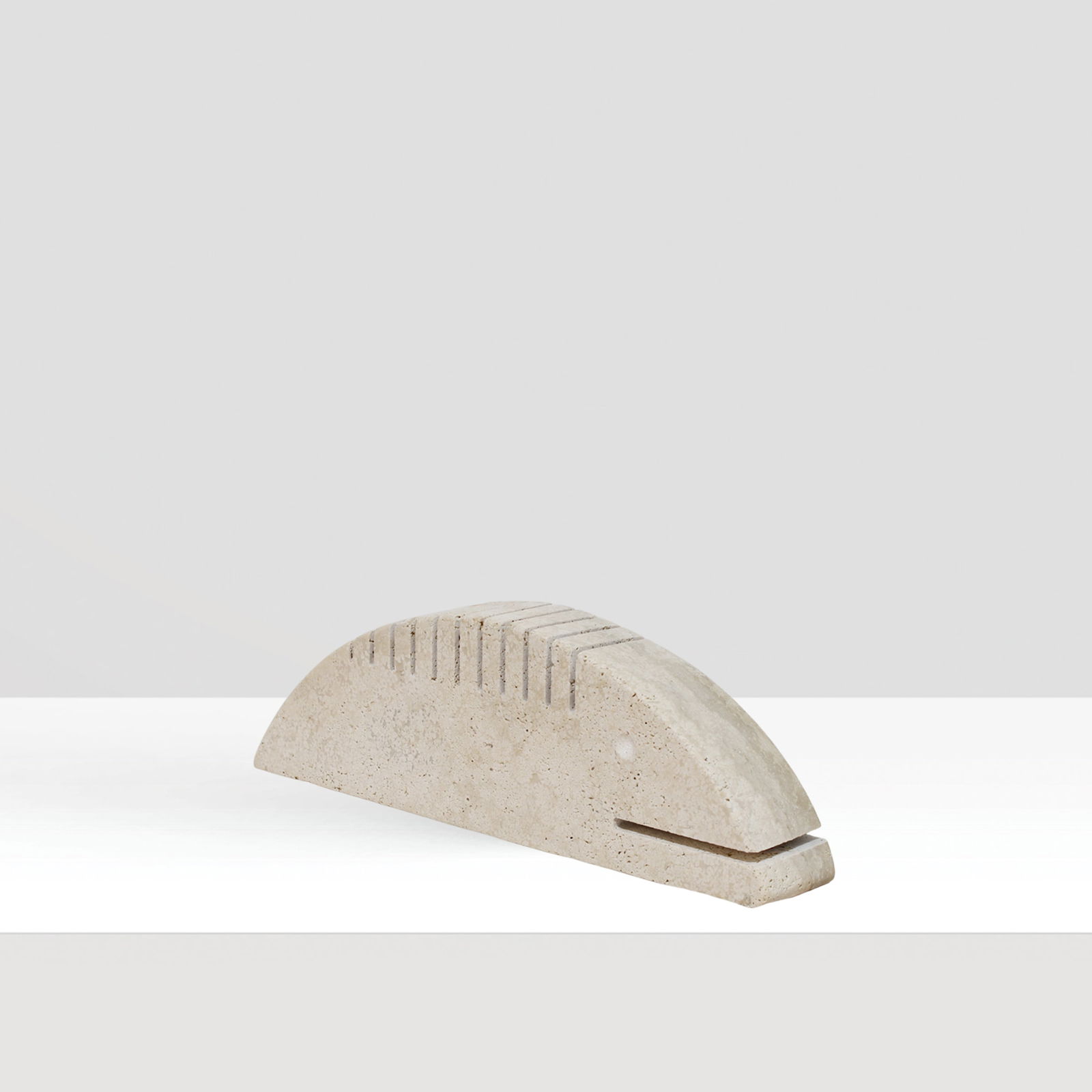 Enzo Mari prod. Fratelli Manelli Italy, 20th century 10x31x5 cm: travertine sculpture depicting a fish.