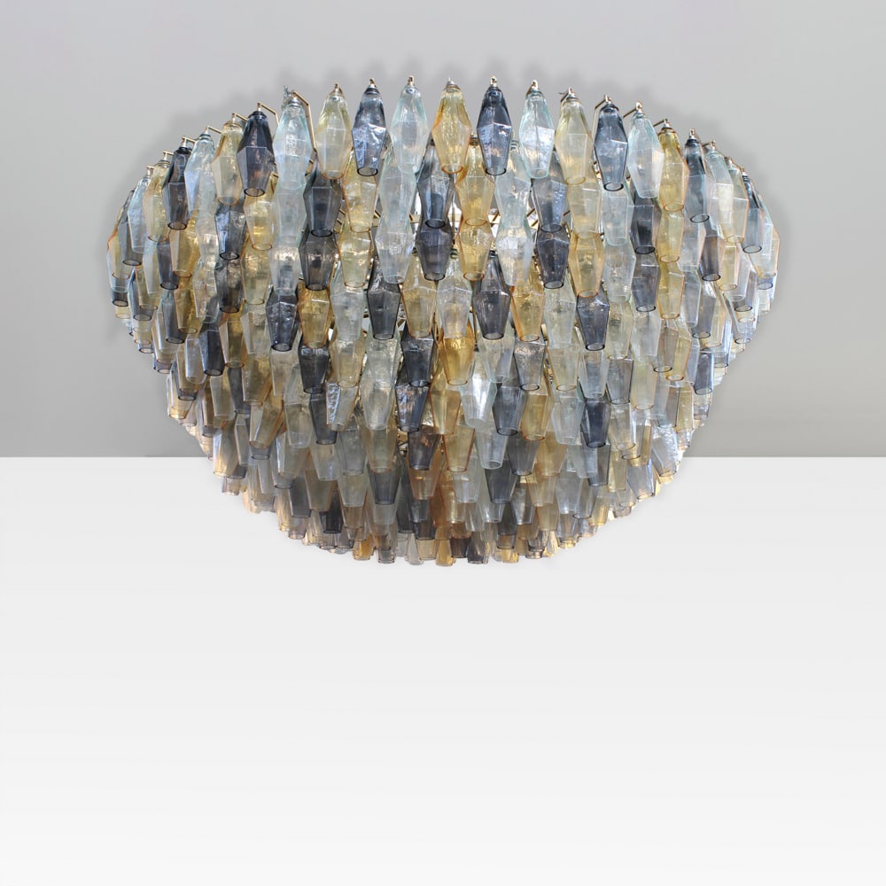 Murano manufacture Murano, 20th century 70x130 cm: Poliedri pendant lamp in colored and clear glass, with brass details and gilt metal frame.