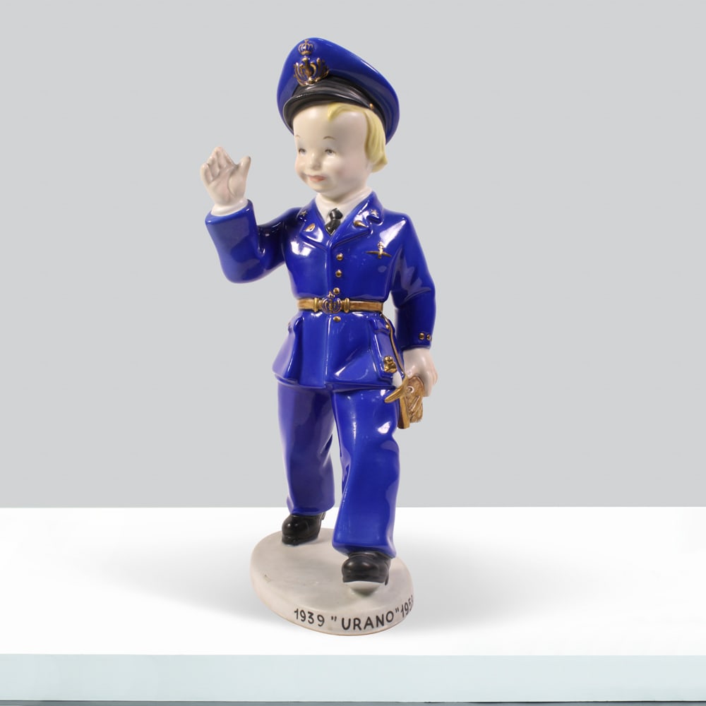 Lenci Manufacture Turin, 20th century h. 27cm: polychrome-painted terracotta sculpture depicting a young aviator, made for the ?corso urano? aviation school, signed and bearing the maker?s mark, defects