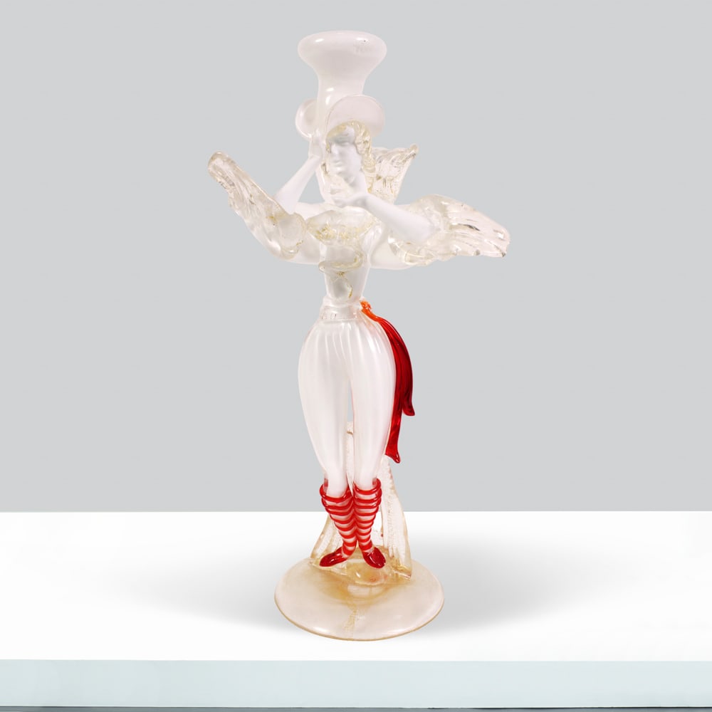 Italian manufacture Italy, 20th century h. 27cm: Murano glass sculpture depicting a figure in period costume.