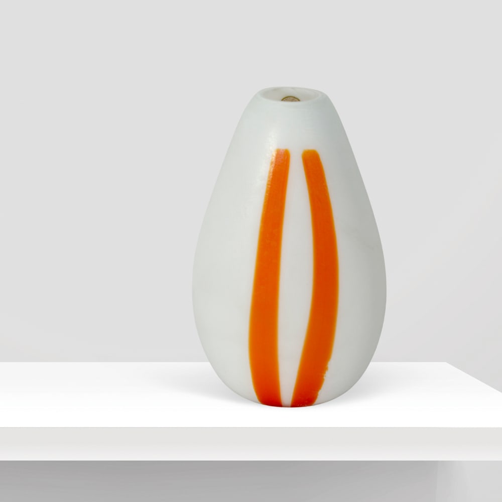 Aureliano Toso Murano, 20th century h. 27.5cm: lattimo glass vase with orange banding, bearing the manufacturer?s label.