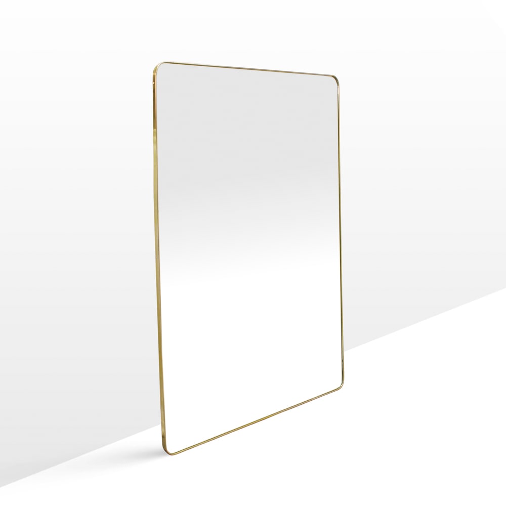 Gio Ponti, attributed to Italy, 1970s 180x120 cm: wall mirror in brass and mirrored glass.