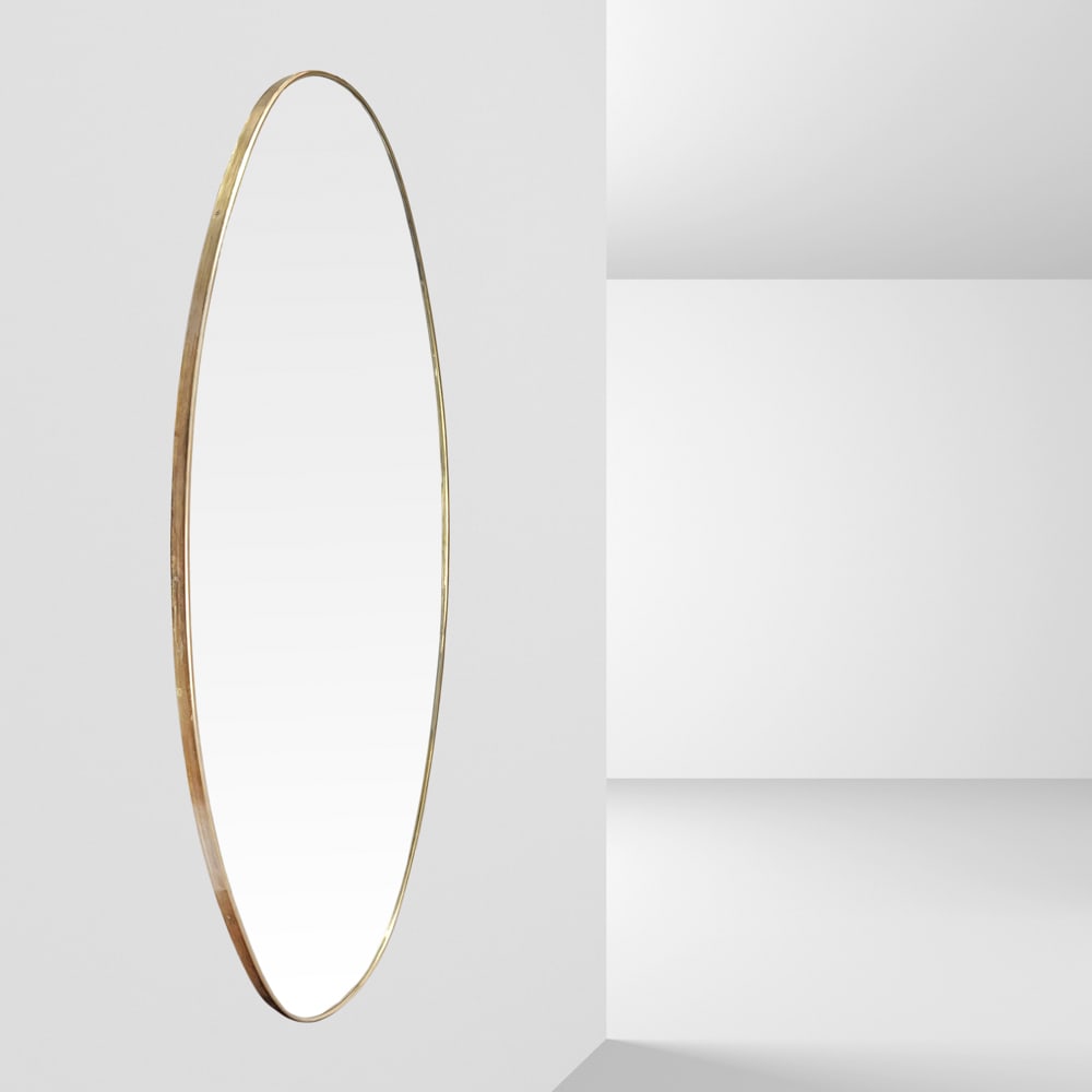 Gio Ponti, attributed to Italy, 1970s 140x70 cm.: oval wall mirror in brass and mirrored glass.