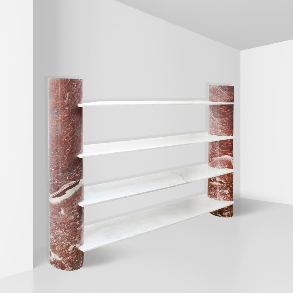 Angelo Mangiarotti, prod. Skipper Italy, 1980s 150x215x30 cm: bookcase mod. Loico with red marble columns and white marble shelves, bearing manufacturer?s label.