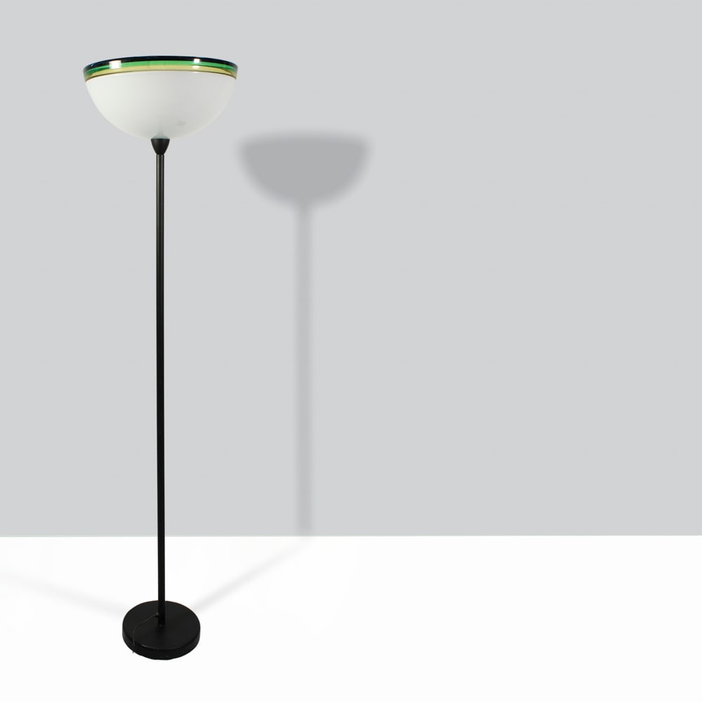 Murano manufacture 20th century h. 190 cm.: floor lamp in lattimo glass with yellow, green and black rim and metal stem.