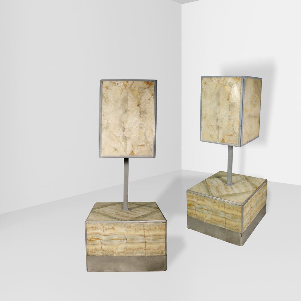 Tommaso Barbi Italy, late 1960s 115x48x48 cm: Pair of wheeled side tables in alabaster and metal with lamps, made for the Hotel delle Nazioni, Rome.
