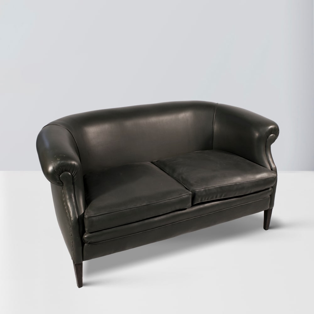 Guglielmo Ulrich, attributed Italy, 20th century 72x146x80 cm: sofa covered in green skai, studs marked 'Wild', defects.