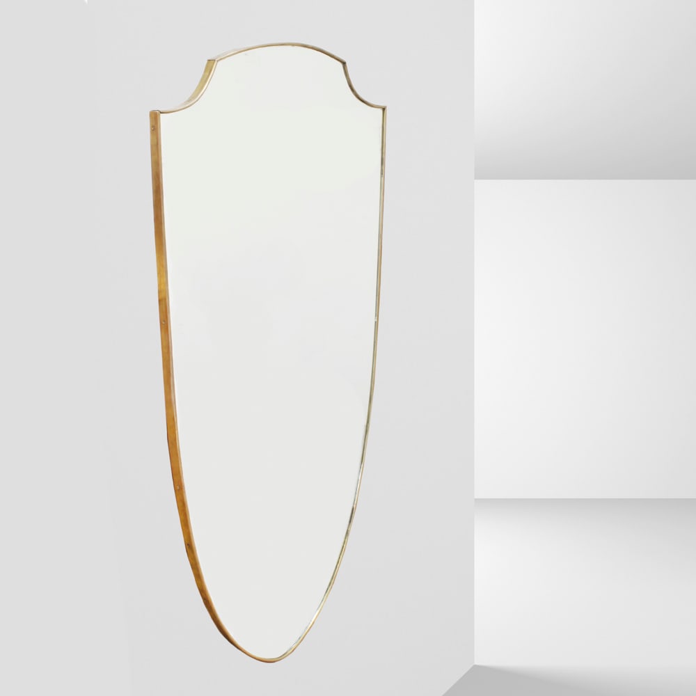 Gio Ponti, attributed to Italy, 1960s 133x73 cm: wall mirror in brass and mirrored glass.