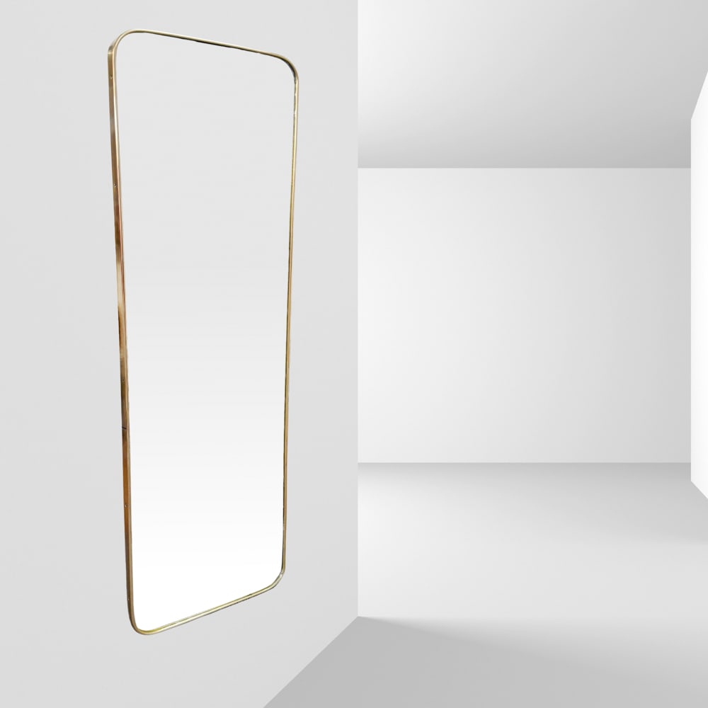 Gio Ponti, attributed to Italy, 1960s 144x43 cm.: wall mirror in brass and mirrored glass.