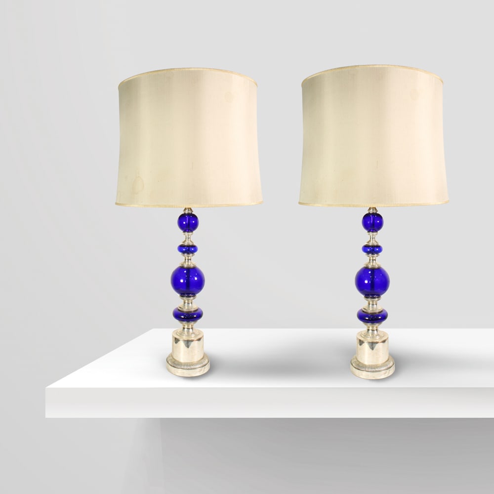 Gaetano Sciolari Italy, 1960s h. 86 cm: pair of lamps mod. F3 in silver metal and glass. Production mark under the base, slight defects.
