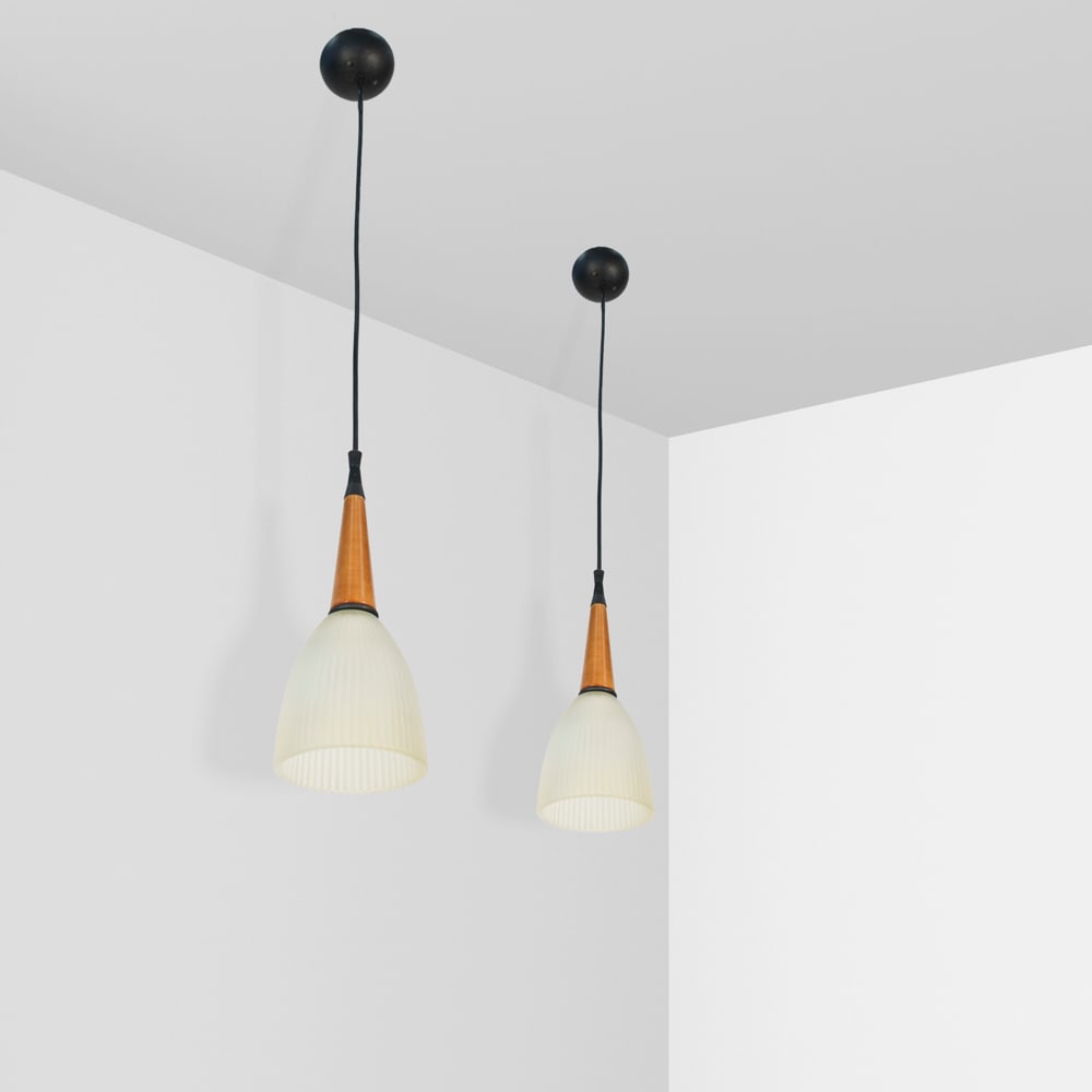 Italian manufacture 20th century h. 30 cm.: Pair of pendant lamps with amber glass lampshade and metal and wood base.