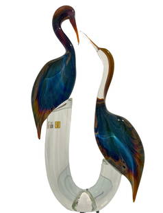 Murano Glass Herons by Zanetti: This lovely pair of Herons was created in the furnaces of Murano Glass Master Oscar Zanetti. Using the calcedonia glass treatment makes this a statement piece in any room with wonderful vibrant colors