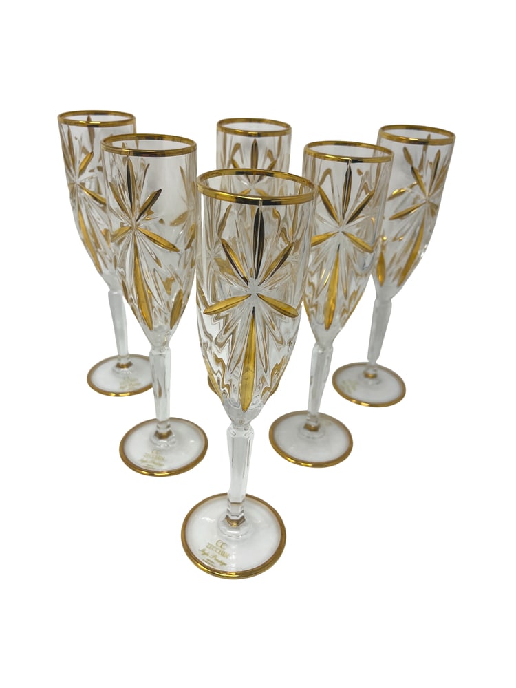 Venetian Flutes, Set of 6: This lovely set of 6 flutes features incredible gold coloring and would be a wonderful addition to any home. Handcrafted in Italy of fine cut crystal and beautifully hand painted by Venetian