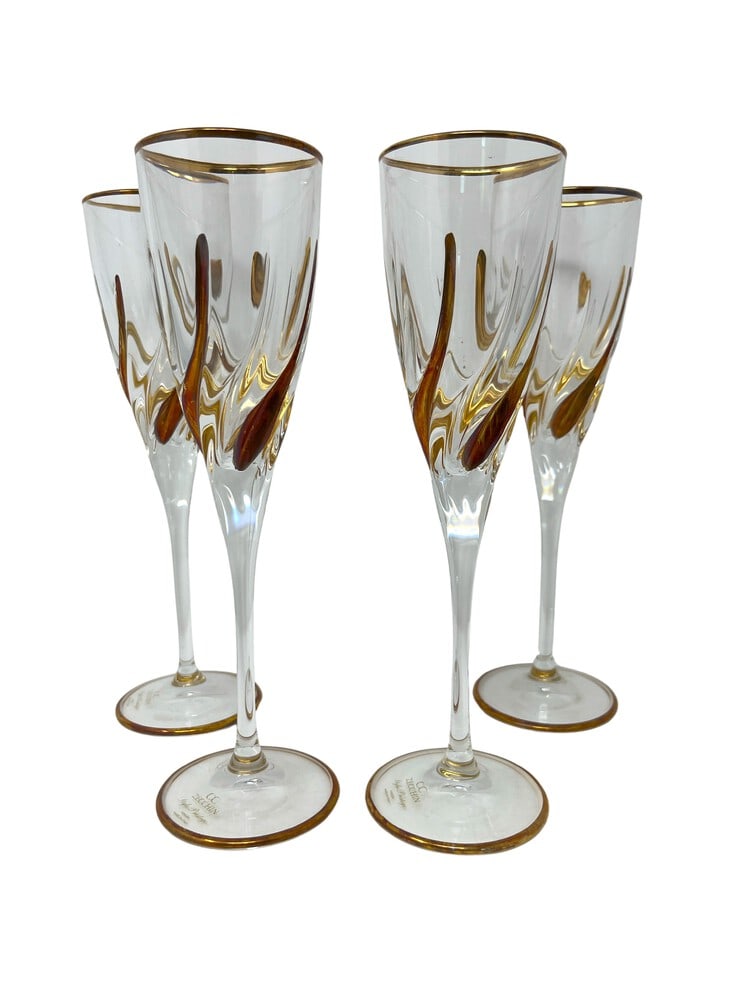 Venetian Flutes, Set of 4: This lovely set of 4 flutes features incredible gold coloring and would be a wonderful addition to any home. Handcrafted in Italy of fine cut crystal and beautifully hand painted by Venetian