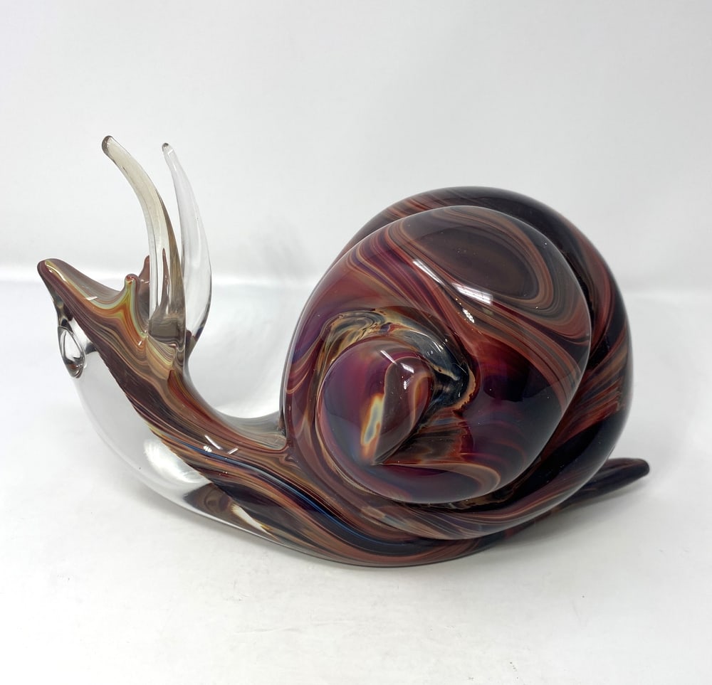 Murano Glass Snail: This lovely Snail was created by one of Murano's top Glass Masters. Made using the calcedonia style, the coloring is incredible, especially under light. Signed. Measures 10" long.