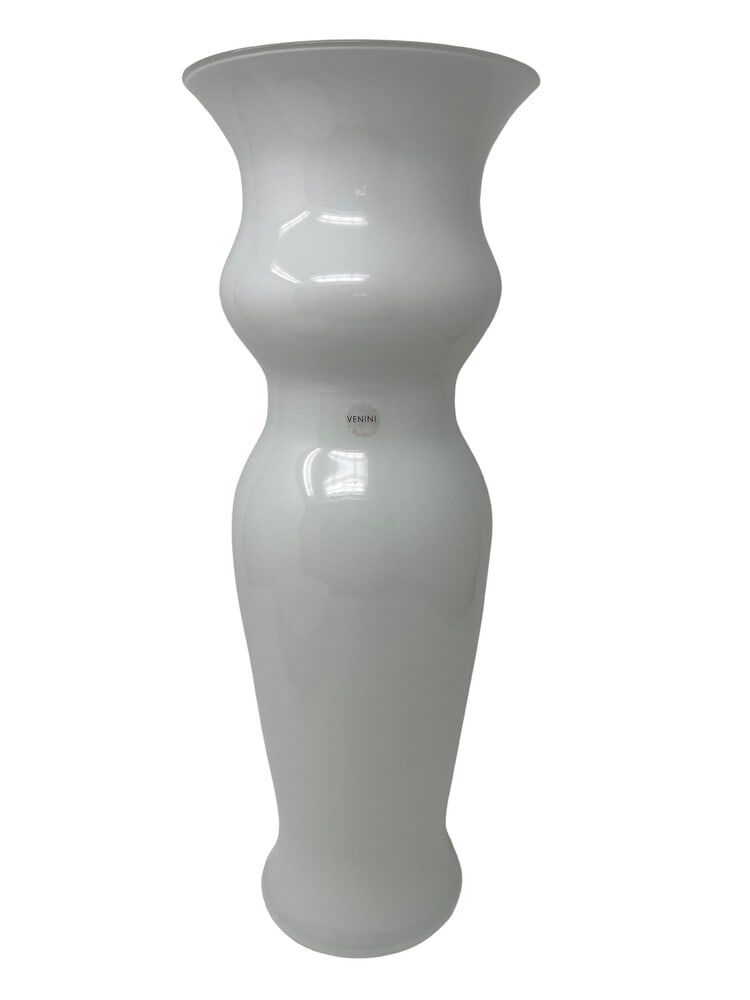 Venini Odalische Classic Vase in White: Odalische is one of the classic vases designed by the world-renowned Murano Glass Venini Furnaces. This piece stands 16.5" tall. Signed and dated. This piece has a tiny piece of ash in the glass,