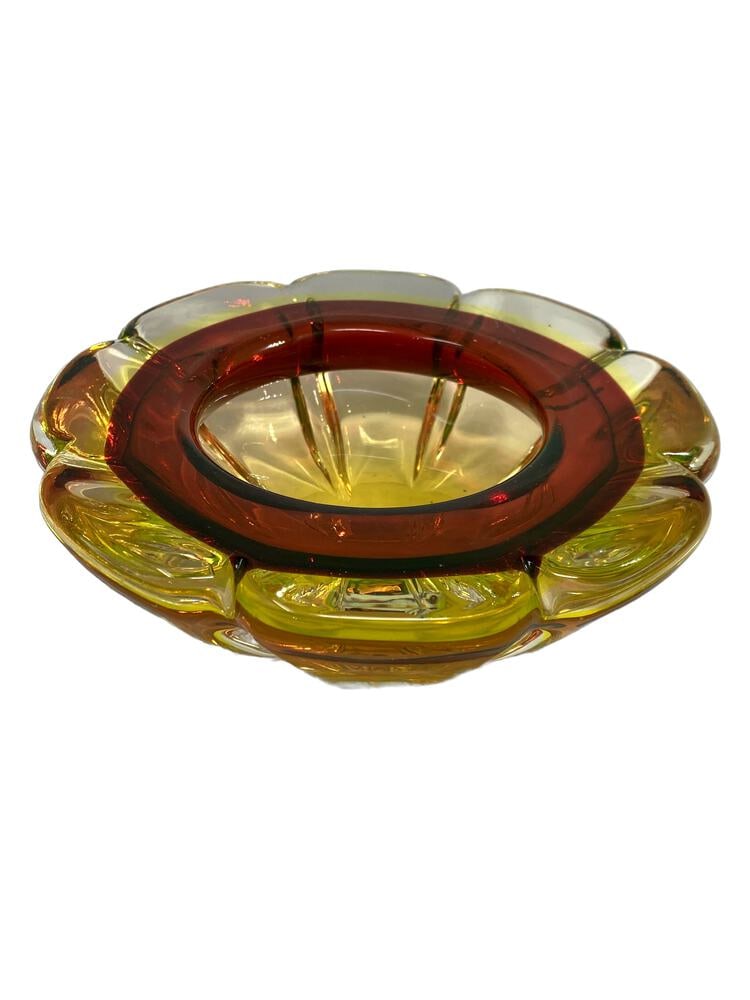 Vintage Uranium Murano Glass Ashtray: Very unusual and rare example of Uranium Glass made in Murano, Italy. In wonderful condition. Beautiful red and yellow coloring. Measures 7.5" across.