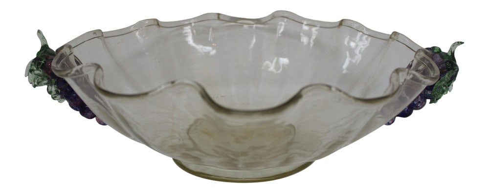 Vintage Murano Glass Bowl: This lovely bowl features hand-formed grape clusters for handles and is beautifully colored in an amethyst shade. Vintage Murano piece that would look great in any setting. Made by Fratelli Tosi.