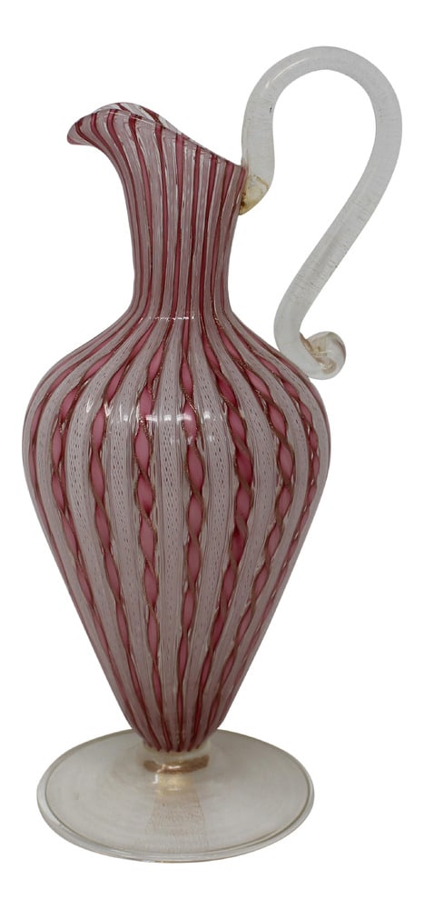 Vintage Latticino Murano Glass Pitcher: Spectacular example of Murano Glass using the latticino treatment of caned glass. A perfect and rare piece of glass which would be a wonderful accent piece in any room. 12" tall!