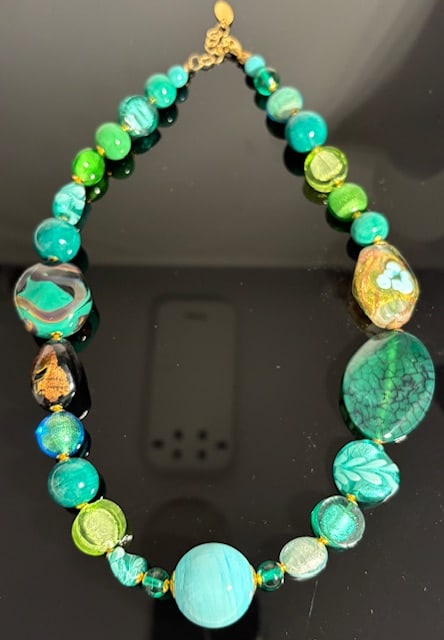 Murano Glass Necklace: Beautiful handmade necklace from the Artisans of Murano. Each bead is meticulously crafted and made into a wonderful and unique piece of jewelry. Measures 21".