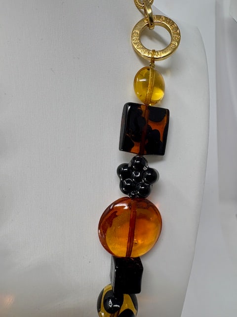 Murano Glass Necklace: Beautiful handmade necklace from the Artisans of Murano. Each bead is meticulously crafted and made into a wonderful and unique piece of jewelry. Measures 21".