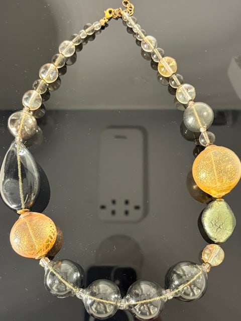Murano Glass Necklace: Beautiful handmade necklace from the Artisans of Murano. Each bead is meticulously crafted and made into a wonderful and unique piece of jewelry. Measures 23".