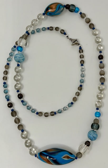 Murano Glass Necklace: Beautiful handmade necklace from the Artisans of Murano. Each bead is meticulously crafted and made into a wonderful and unique piece of jewelry. Measures 36".