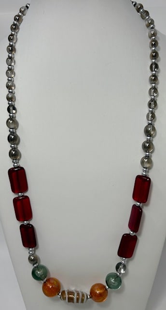 Murano Glass Necklace: Beautiful handmade necklace from the Artisans of Murano. Each bead is meticulously crafted and made into a wonderful and unique piece of jewelry. Measures 23".