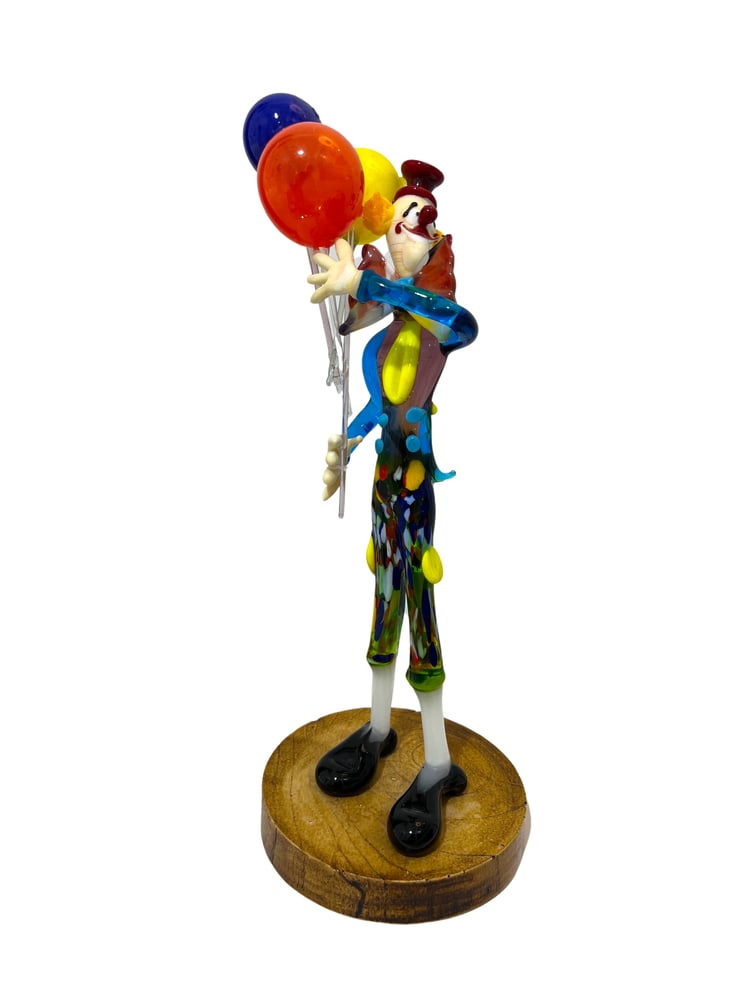 Murano Glass Clown with Balloons: Murano Glass Clown Figurine by Renowned Glass Master Tommasi. Add a touch of whimsy and elegance to your home decor with this exquisite Murano glass clown figurine, expertly crafted by one of the