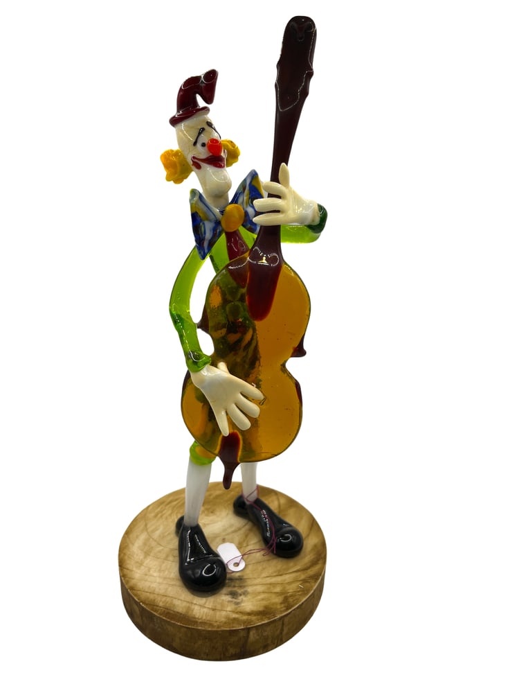 Murano Glass Guitar Playing Clown: Murano Glass Clown Figurine by Renowned Glass Master Tommasi. Add a touch of whimsy and elegance to your home decor with this exquisite Murano glass clown figurine, expertly crafted by one of the