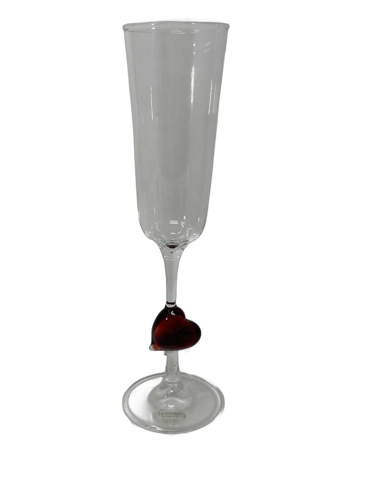 Pair of Murano Glass Flutes with Hearts: Hand made in Murano, these lovely flutes are quite unusual, featuring a red heart in the stem. Set of 2. Measure 8.5" tall.