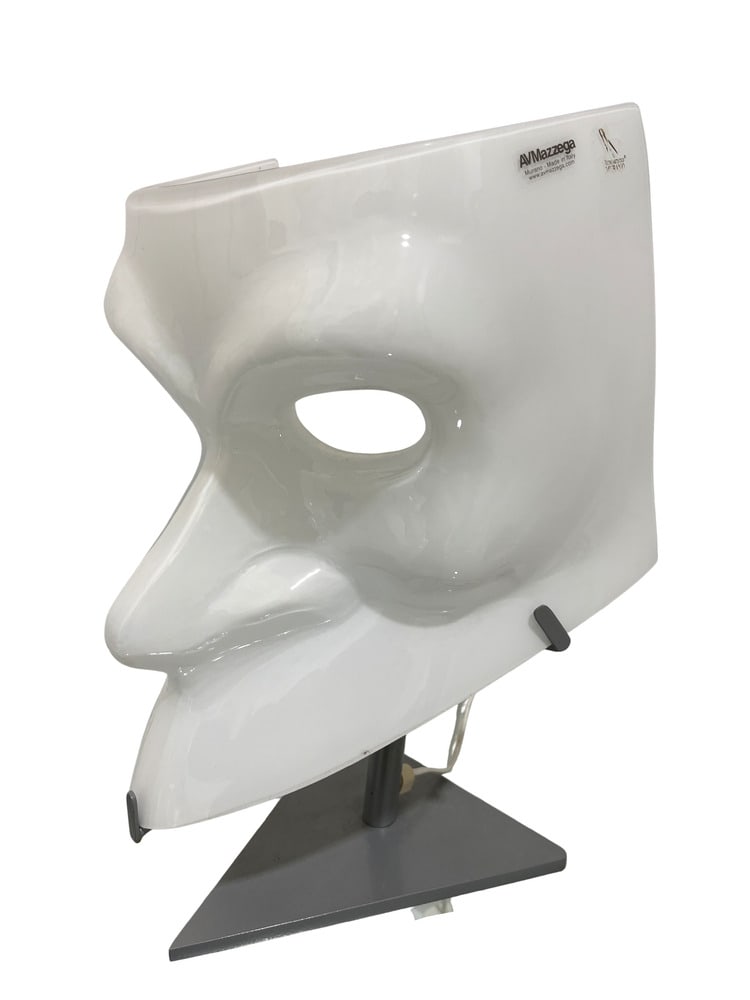 Bauta Venetian Mask Murano Glass Table Lamp by Mazzega: This lovely Bauta Venetian Mask table lamp was hand-formed in the furnaces of Mazzega in Murano, Italy. A very unusual and attractive piece that would enhance any room. Measures 15" tall.