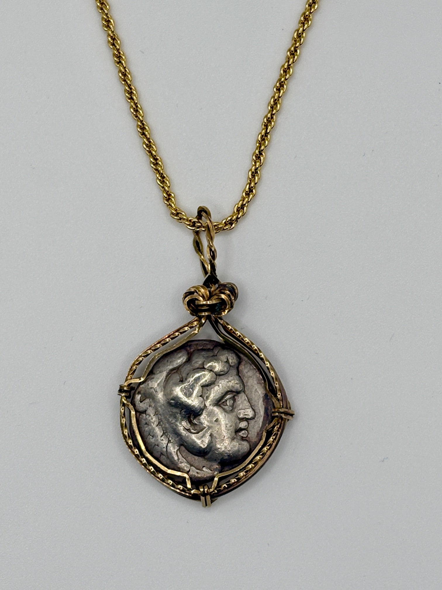 Spectacular Alexander the Great Coin Pendant: Acquire a piece of ancient history with this genuine Alexander the Great coin, featuring Hercules and Zeus, masterfully converted into an exquisite pendant necklace. (#321)Highlights:- Authentic ancie