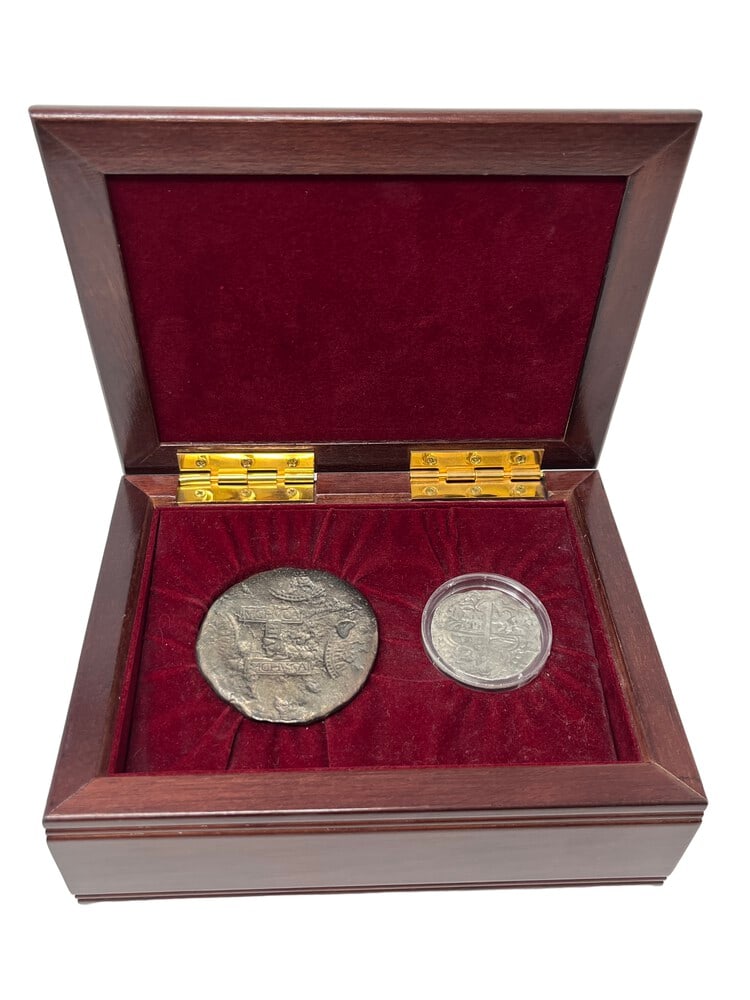 Rare Atocha 8 Reale in Display Case: This rare 8 Reales silver coin was found by Mel Fisher at the Atocha Shipwreck site. It was certified and signed by Fisher, guaranteeing that it was minted between 1619-1622. The Minting took place