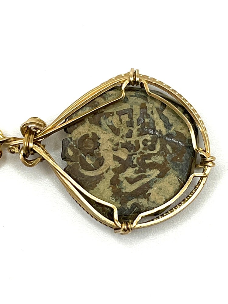 Spanish Shipwreck Coin 8 Reale Dated 1652: Rare Dated Spanish Shipwreck Coin Pendant-A Piece of HistoryOwn a piece of ancient history with this authentic bronze coin, expertly transformed into a stunning pendant. (#416) Features:Genuine ancien