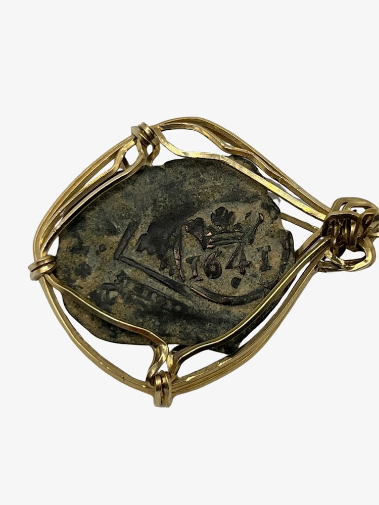Spanish Shipwreck Coin 8 Reale Dated 1641: Rare Dated Spanish Shipwreck Coin Pendant-A Piece of HistoryOwn a piece of ancient history with this authentic bronze coin, expertly transformed into a stunning pendant. (#417) Features:Genuine ancien