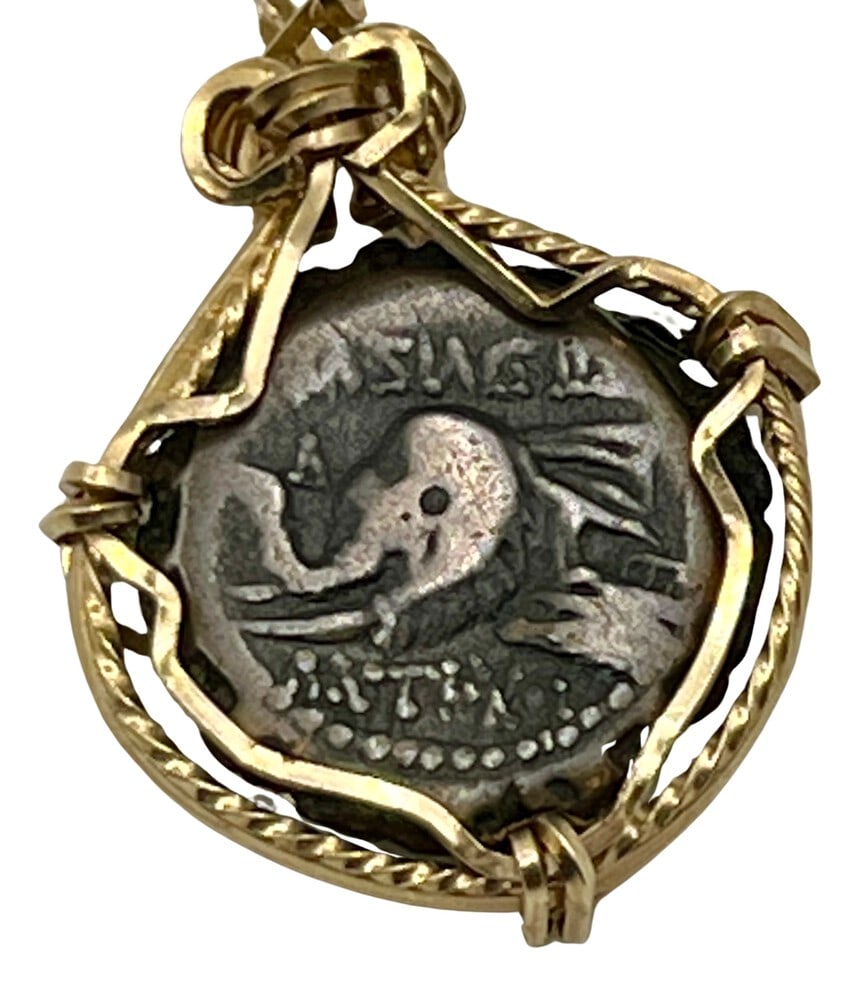 Ancient Elephant Pendant Coin from 160 BCE: Acquire a fragment of ancient history with this genuine bronze coin, featuring an Elephant and Demetrios I, masterfully converted into an exquisite pendant necklace. (#90)Highlights:- Authentic ancien
