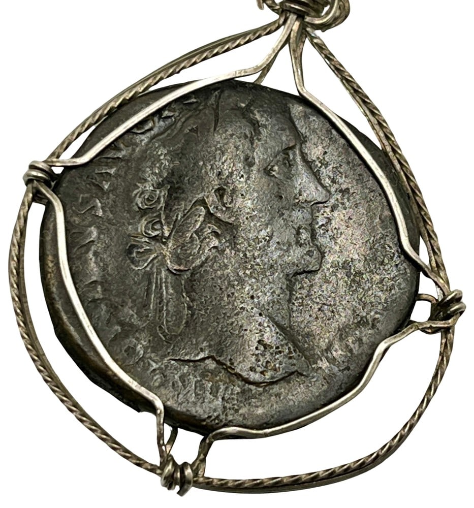 Roman Emperor Pius Coin Pendant: Acquire a fragment of ancient history with this genuine bronze coin, featuring Emperor Pius and Libertas, masterfully converted into an exquisite pendant necklace. (#286)Authentic ancient bronze coin