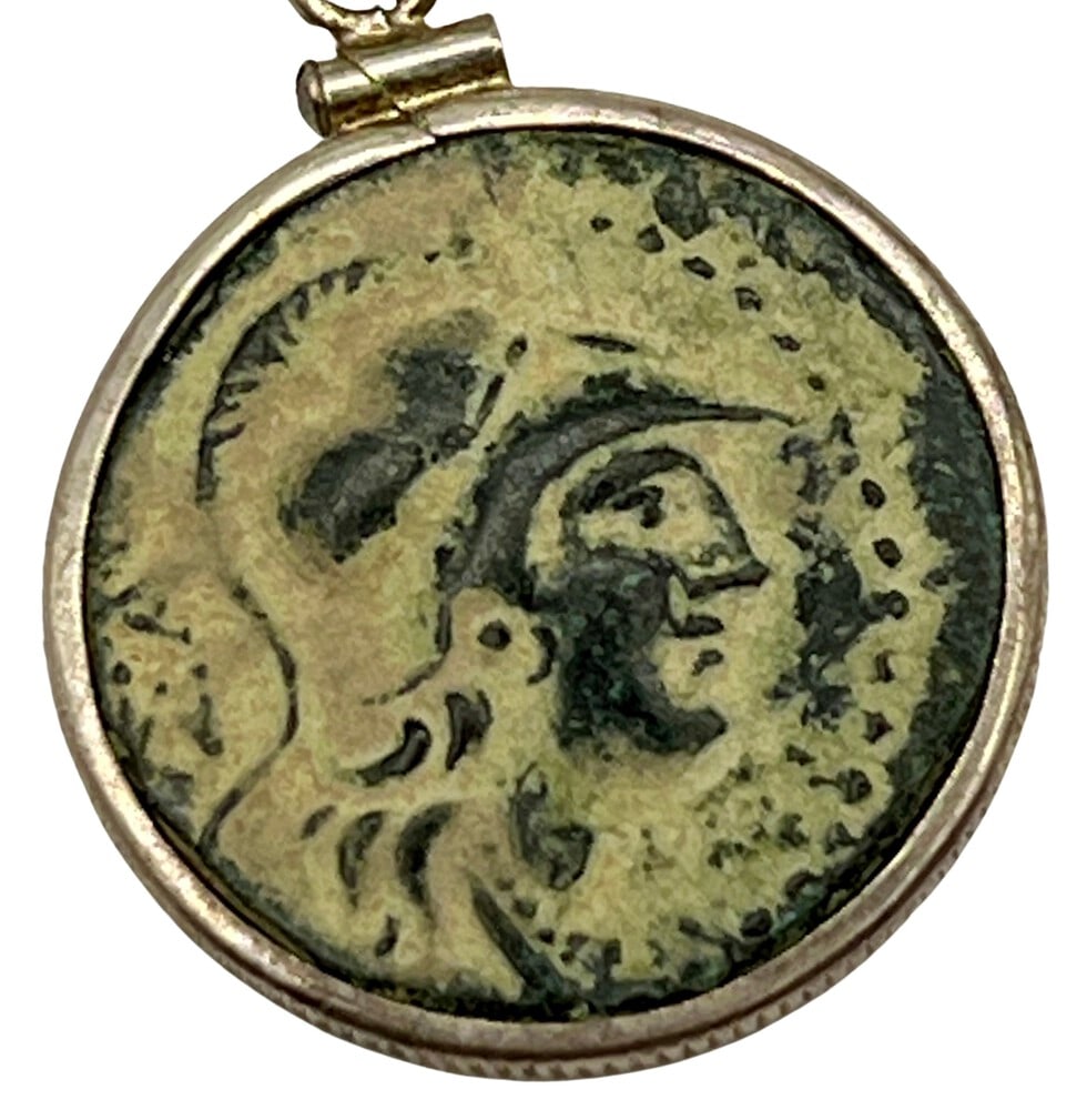 Exquisite Athena Coin with Incredible Patina Made into a Necklace: Genuine ancient coin (circa 330 BCE). Beautifully mounted in a pendant setting, showcasing the coin’s intricate details.Includes a Certificate of Authenticity from a reputable dealer.Paired with