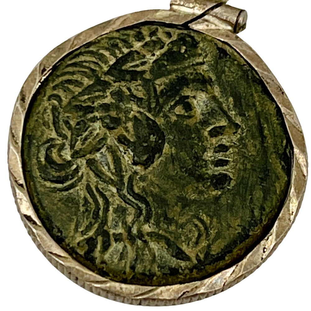 Ancient Greek Coin of Dionysus as Pendant: Dionysus, God of Wine, authentic bronze coin, expertly transformed into a stunning pendant necklace. (#376)Genuine ancient bronze coin (circa 148 BCE).Beautifully mounted in a pendant setting, showcas