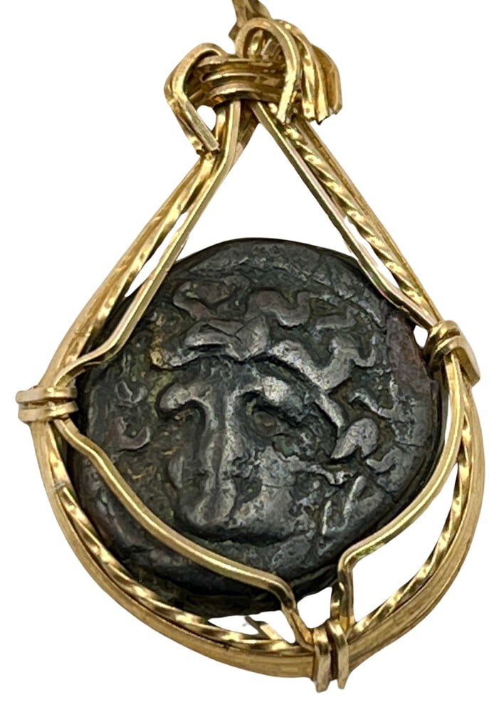 Ancient Helios Trojan War Coin: Acquire a fragment of ancient history with this genuine Trojan War coin, featuring Helios and a Horse, masterfully converted into an exquisite pendant necklace. (#288)- Authentic ancient bronze coin